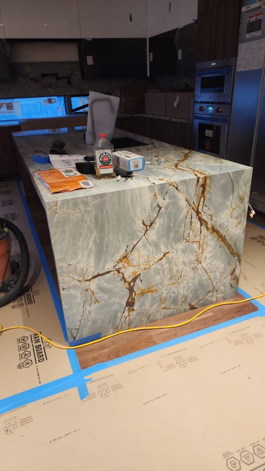 Mitered waterfall island in veined quartzite